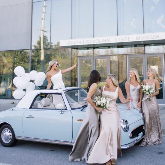 Bride and Bridesmaids With Convertible Outside Planetarium at the South Carolina State Museum
