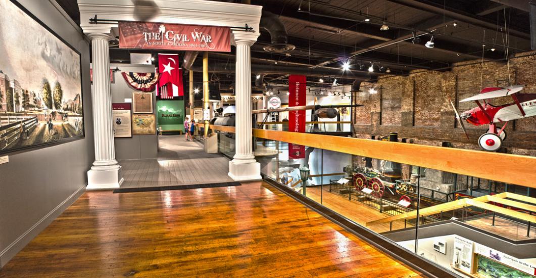 Large, replica white columns with banner that reads The Civil War in South Carolina as the entrance to an exhibition space