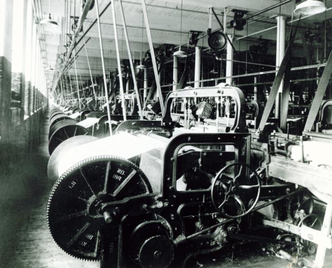 Black and white image of Columbia Mills interior showing loom machinery