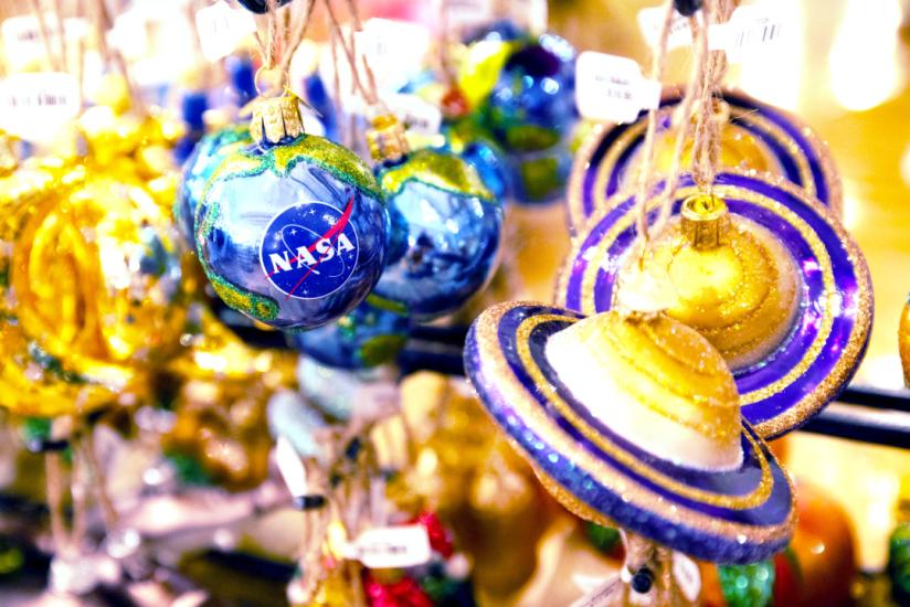 Round Blue NASA Ornament and Blue and Gold Saturn Planet Ornaments On Display